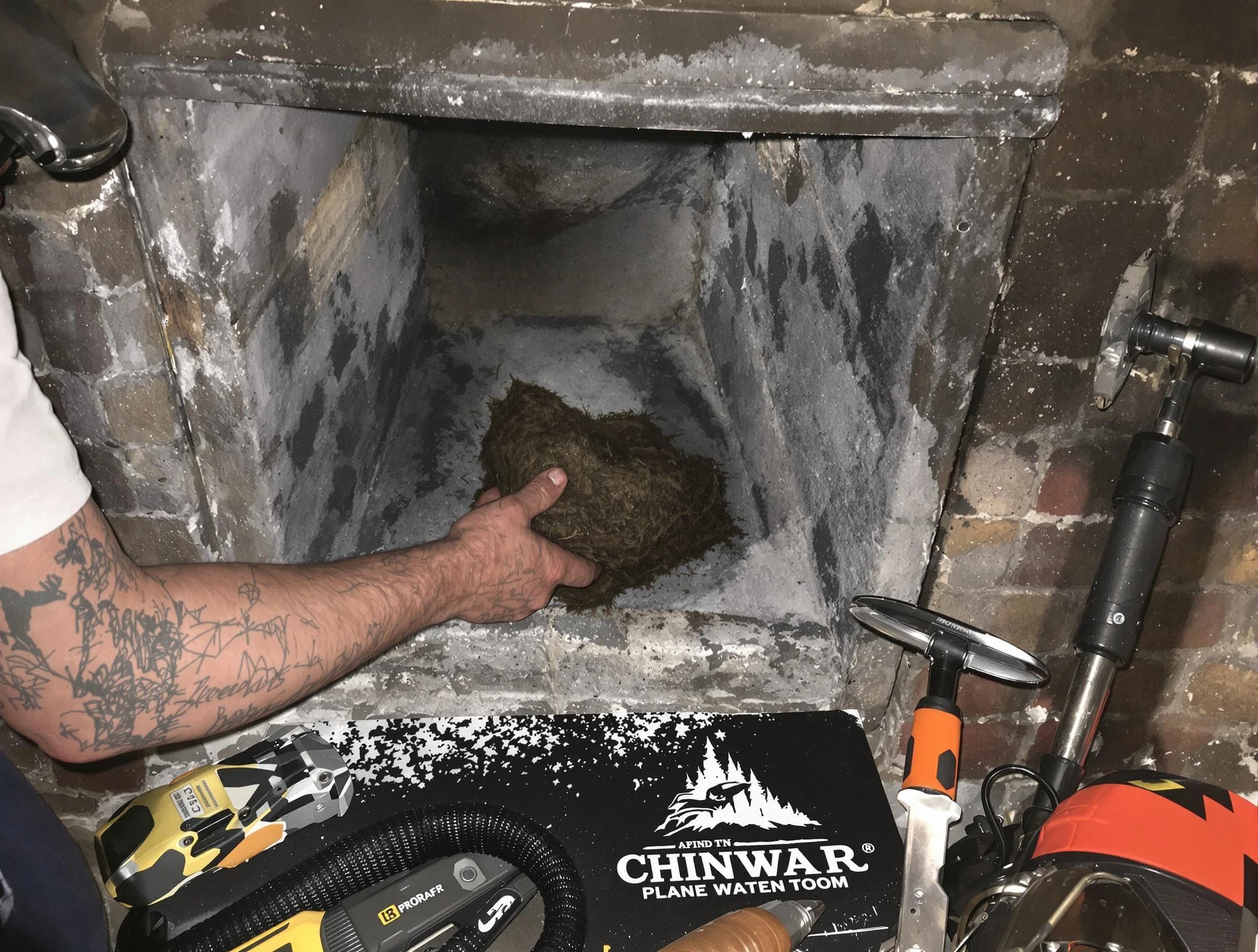 Hampton Chimney Sweep safely removing debris and screening chimney in Hampton, GA